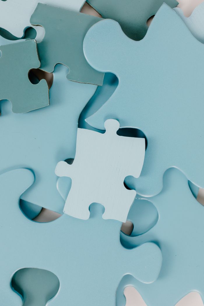 Services High-quality close-up image of blue puzzle pieces, ideal for creativity and problem-solving themes.